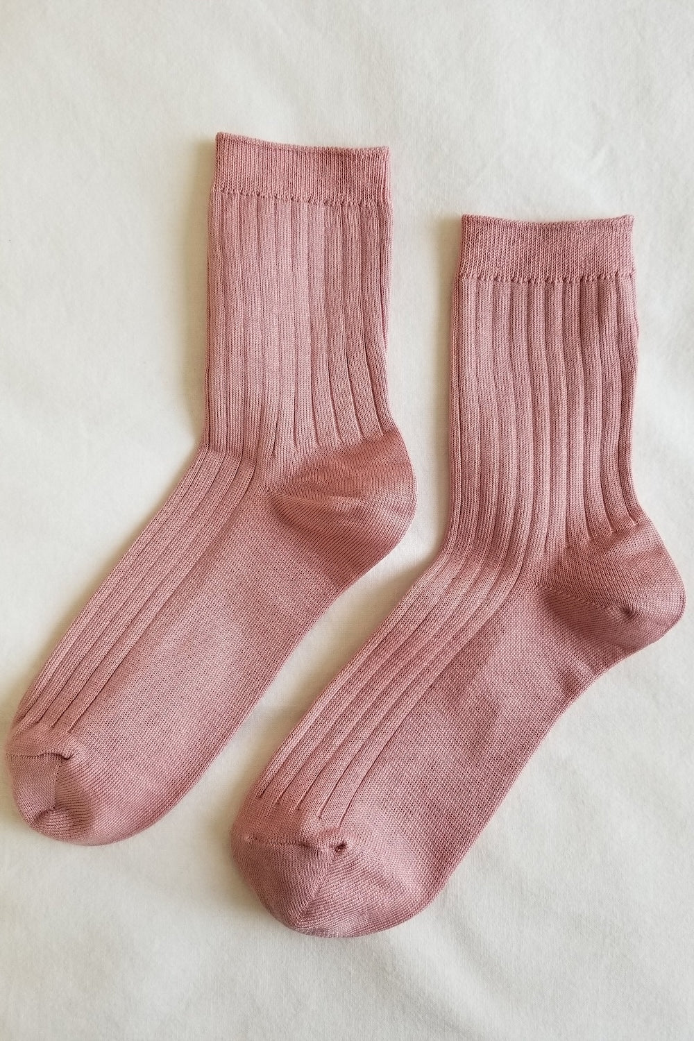 Her Socks in Desert Rose