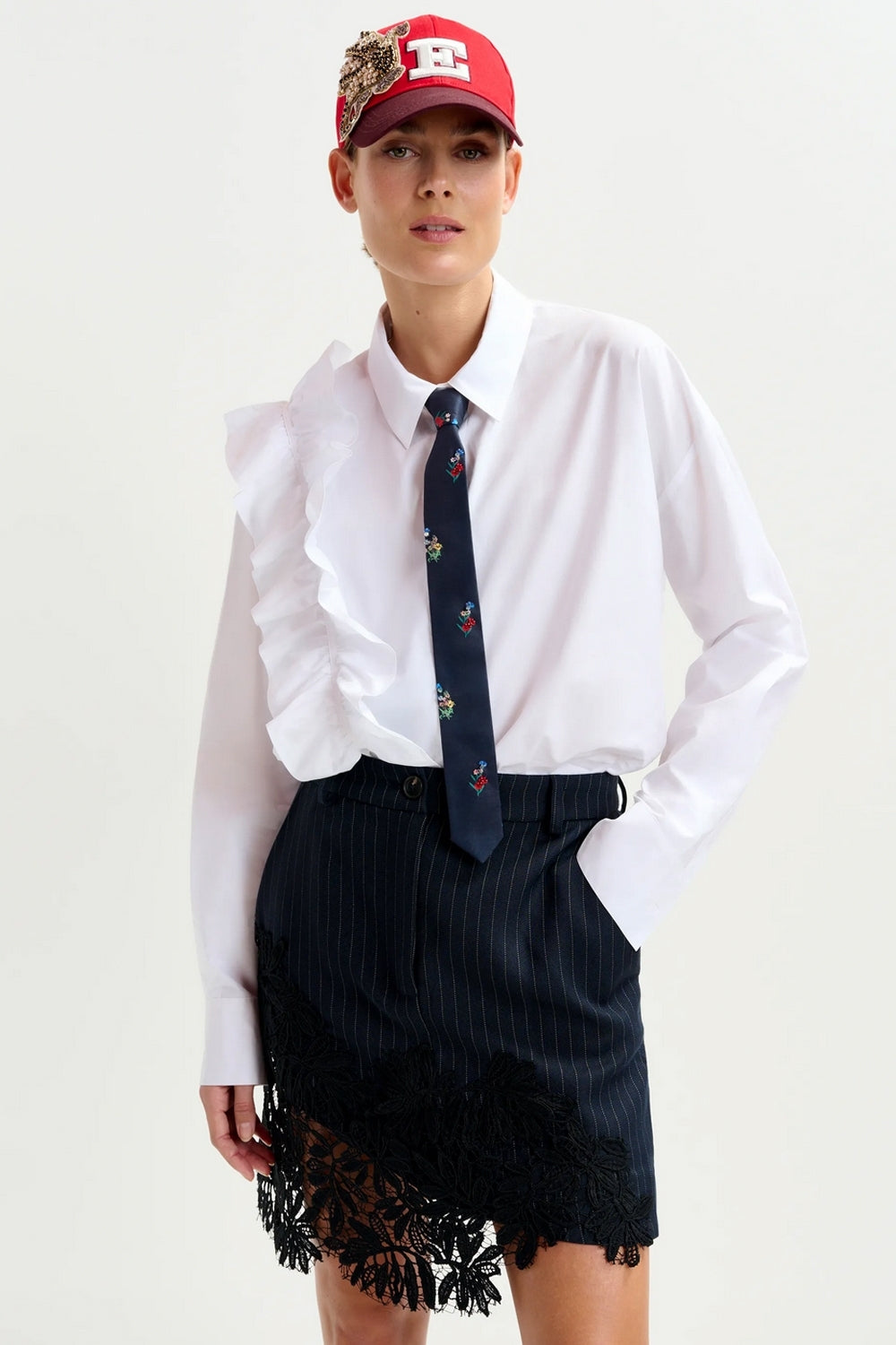 Interior Pinstripe Asymmetric Skirt with Lace Applique in Black