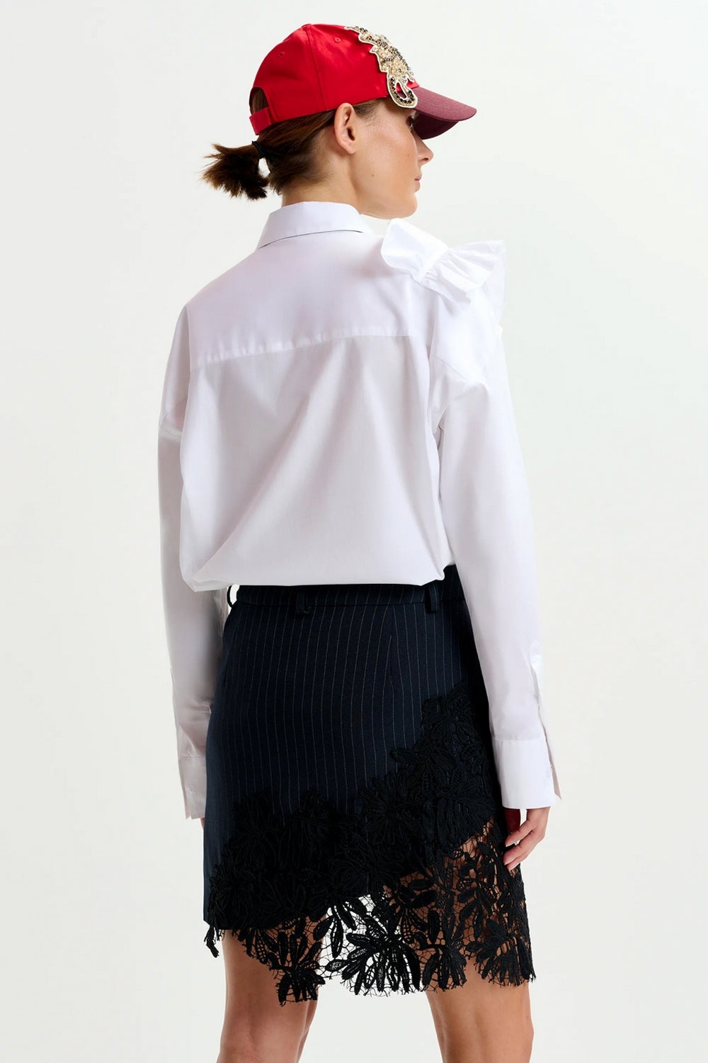 Interior Pinstripe Asymmetric Skirt with Lace Applique in Black