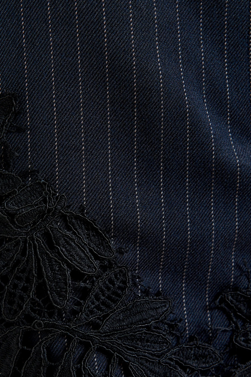 Interior Pinstripe Asymmetric Skirt with Lace Applique in Black